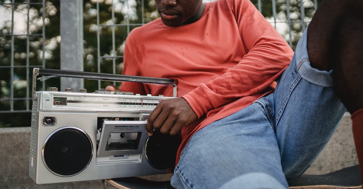 Maximum stay on a Schengen visa is too short after a change of plans - Crop black man in casual clothes opening retro recorder to change cassette during resting on concrete surface with skateboard in city street Maximum stay on a Schengen visa is too short after a change of plans - Crop black man in casual clothes opening retro recorder to change cassette during resting on concrete surface with skateboard in city street