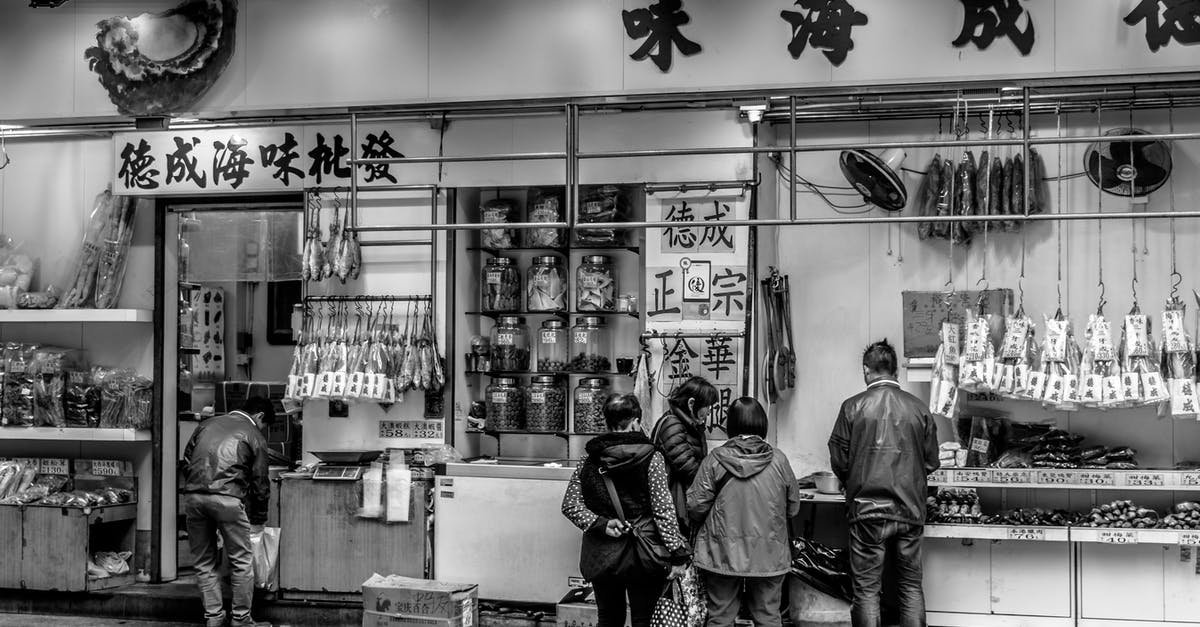 May a Chinese citizen visit Hong Kong for five days? [duplicate] - Grayscale Photography of People Standing in Front of Store