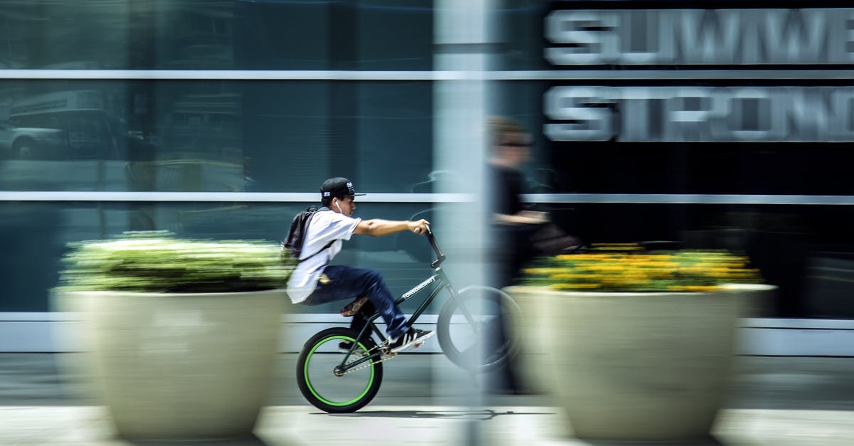 May kids ride in the back of a 5th Wheel in the US? - Man Riding Bicycle in City
