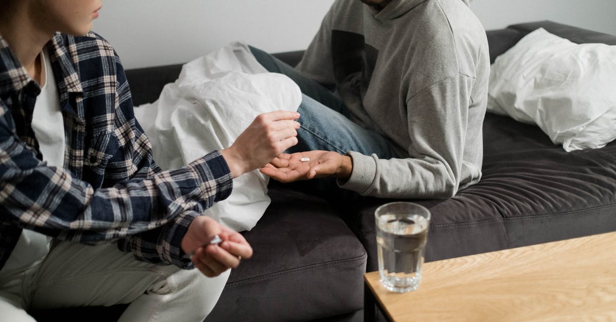 Medication for ADHD - Man in Gray Hoodie Sitting on Couch Medication for ADHD - Man in Gray Hoodie Sitting on Couch