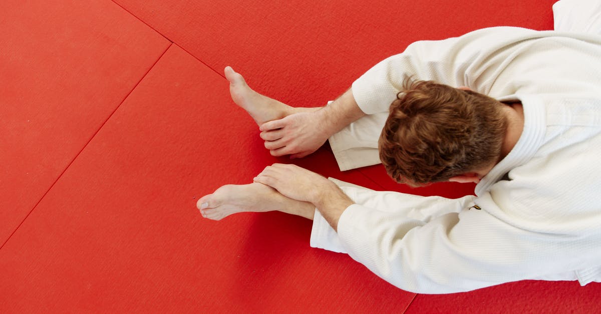 Meet a master swordsmith in Japan - Woman in White Long Sleeve Shirt Lying on Red Floor Meet a master swordsmith in Japan - Woman in White Long Sleeve Shirt Lying on Red Floor