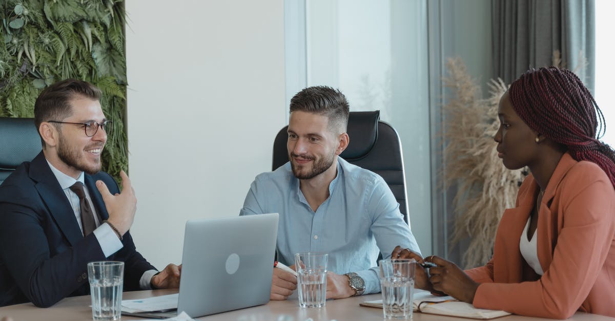 Meeting place in CDG - Coworkers in a Conference Room having a Meeting Meeting place in CDG - Coworkers in a Conference Room having a Meeting
