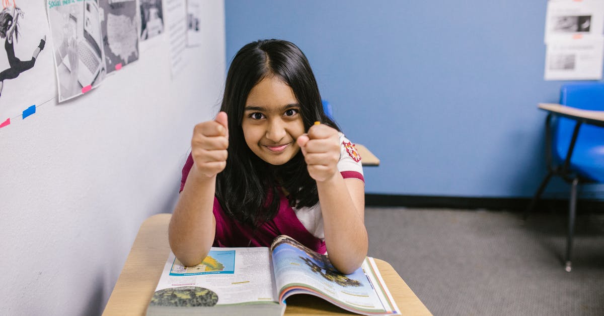 Miles & More: What is a booking class? - Girl Sitting on Her Desk Looking Angry Miles & More: What is a booking class? - Girl Sitting on Her Desk Looking Angry