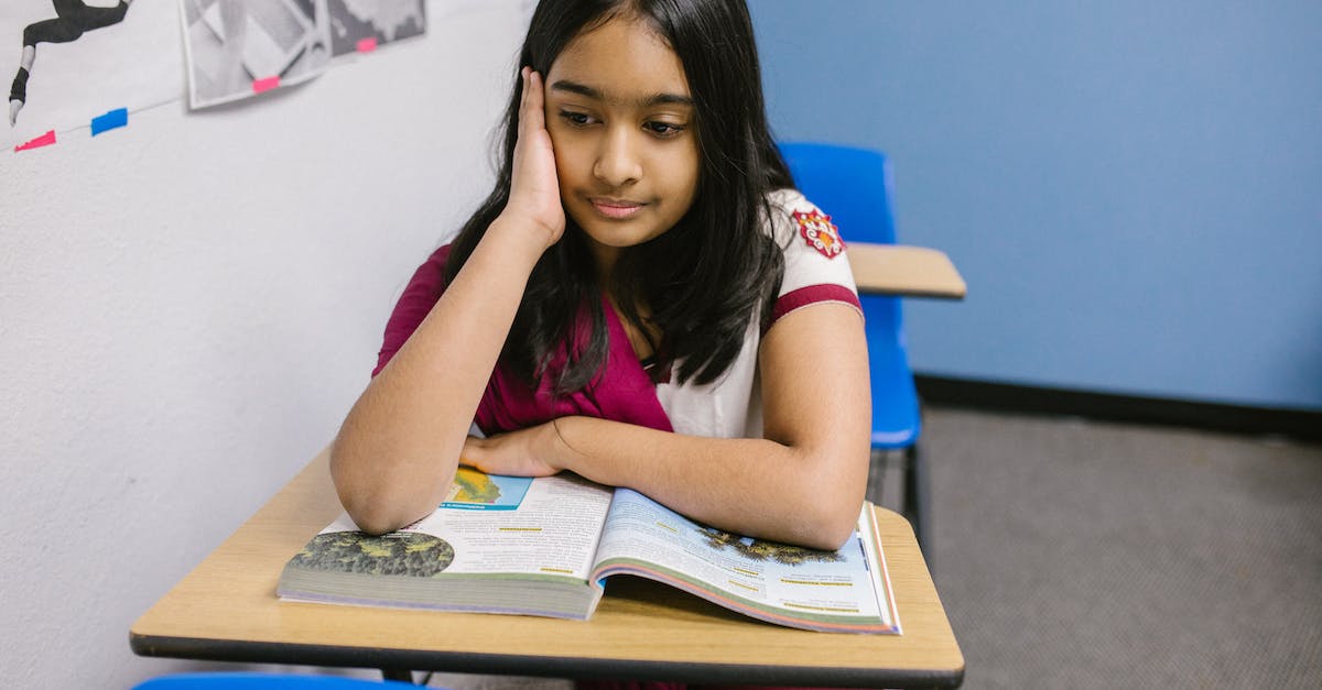 Miles & More: What is a booking class? - Girl Sitting on Her Desk Looking Lonely Miles & More: What is a booking class? - Girl Sitting on Her Desk Looking Lonely