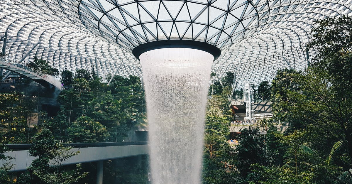 Minimum Connecting time Changi Airport Singapore - Water Falling From Glass Ceiling Minimum Connecting time Changi Airport Singapore - Water Falling From Glass Ceiling