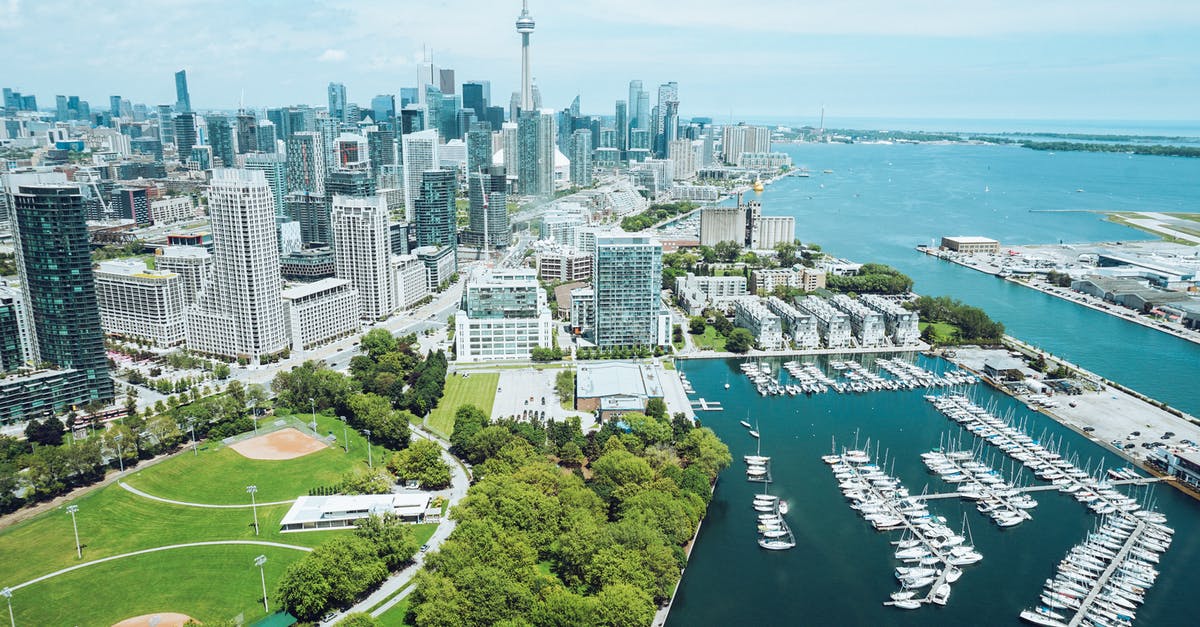 Mobile Data for Short Trip to Toronto, Canada - Architecture and harbor with moored boats of contemporary coastal city Mobile Data for Short Trip to Toronto, Canada - Architecture and harbor with moored boats of contemporary coastal city