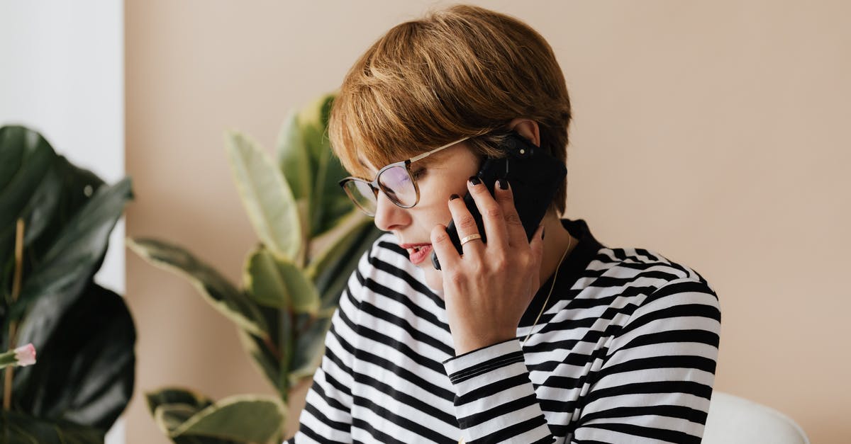 Mobile phone connection in Macedonia for short visit - Serious businesswoman having phone conversation in light workplace Mobile phone connection in Macedonia for short visit - Serious businesswoman having phone conversation in light workplace