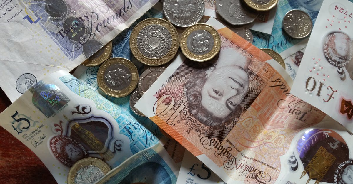 Money at UK border control - Silver and Gold Coins on White Printer Paper Money at UK border control - Silver and Gold Coins on White Printer Paper