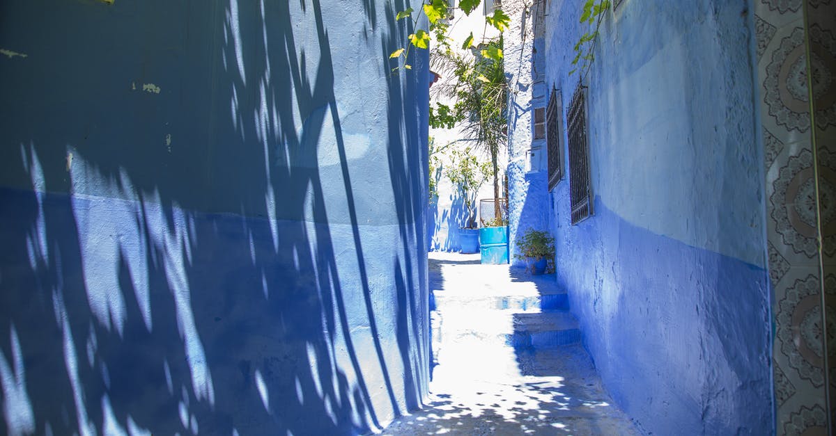 Morocco for an Indian citizen with an EU resident permit - Narrow pathway between blue buildings Morocco for an Indian citizen with an EU resident permit - Narrow pathway between blue buildings