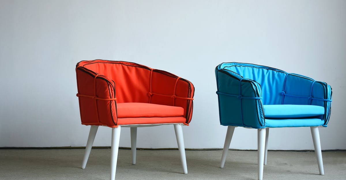 Most comfortable seats for family of four - Philippine Airlines Boeing 777-300er SFO-MNL [closed] - Photo of Red and Blue Chairs