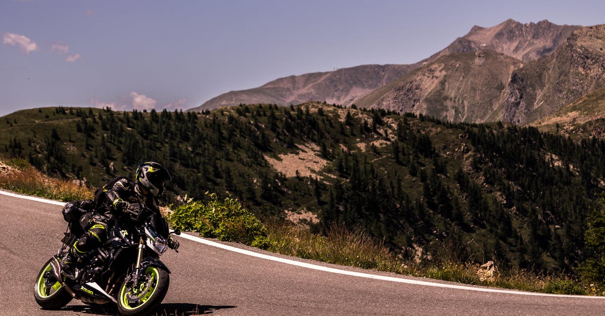 Motion sickness before actual flight, this is hampering my traveling possiblities [duplicate] - Person Riding Motorcycle on Road
