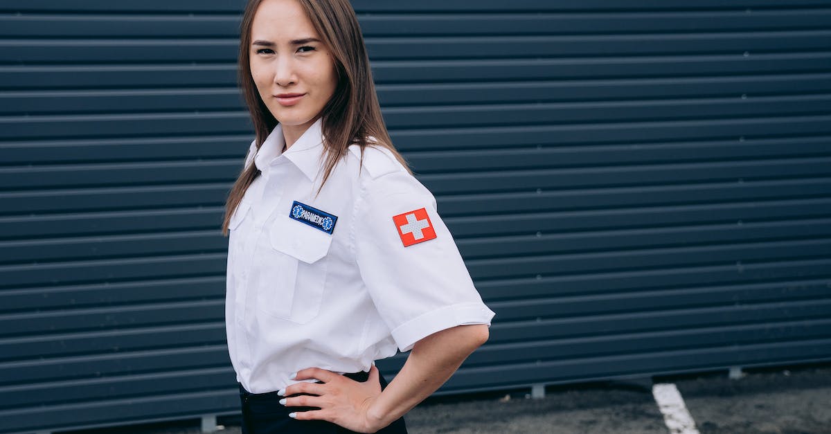 Mountain rescue and medical care in Georgia? - A Paramedic with Her Hand on Waist Mountain rescue and medical care in Georgia? - A Paramedic with Her Hand on Waist