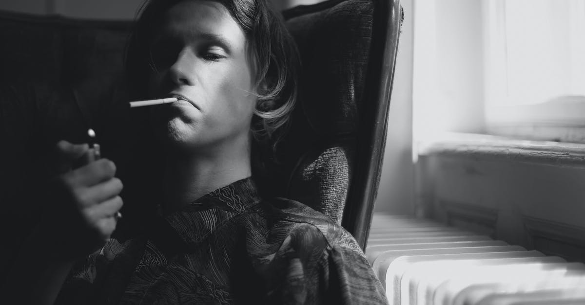 Moved from room after bad insect bite, but what about the next guy? [closed] - Thoughtful man lighting cigarette in room