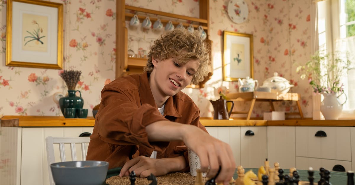 Moving to another country before my visa interview - Teenage Boy Playing Chess in Kitchen Moving to another country before my visa interview - Teenage Boy Playing Chess in Kitchen
