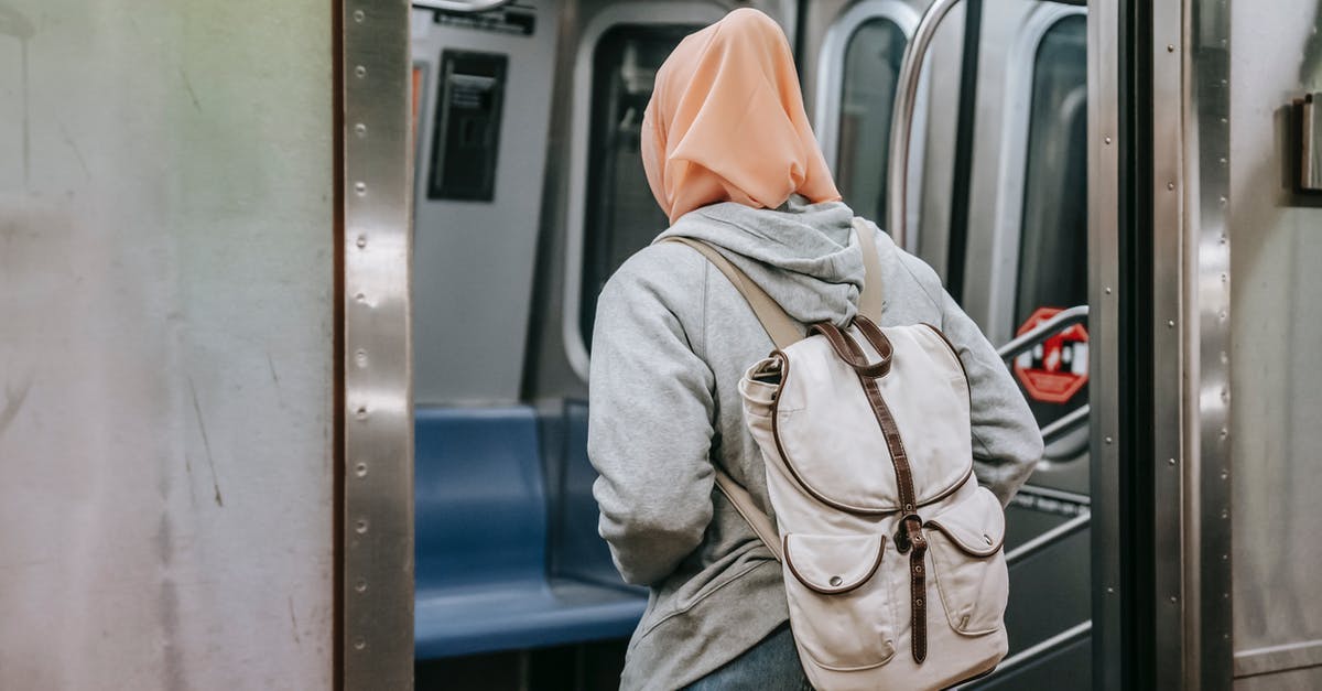 Multiple Entry Brazilian Tourist Visa for Indian Citizen - Unrecognizable woman in hijab walking in train in metro Multiple Entry Brazilian Tourist Visa for Indian Citizen - Unrecognizable woman in hijab walking in train in metro