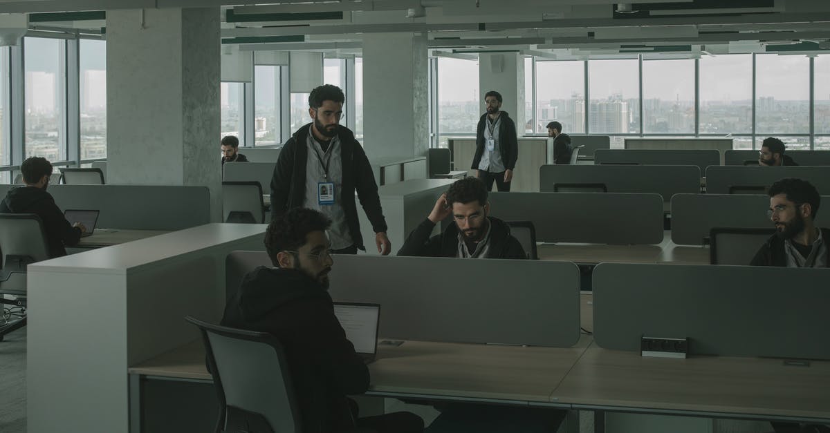 Multiple-entry business Schengen visa - Men Looking Alike Inside an Office Multiple-entry business Schengen visa - Men Looking Alike Inside an Office