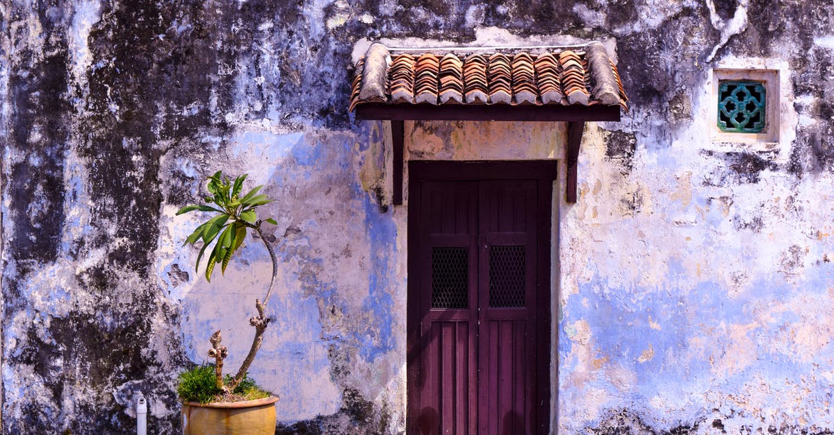 Muscat to Penang via Kuala Lumpur - Green Plants Beside Purple Wooden Door Muscat to Penang via Kuala Lumpur - Green Plants Beside Purple Wooden Door