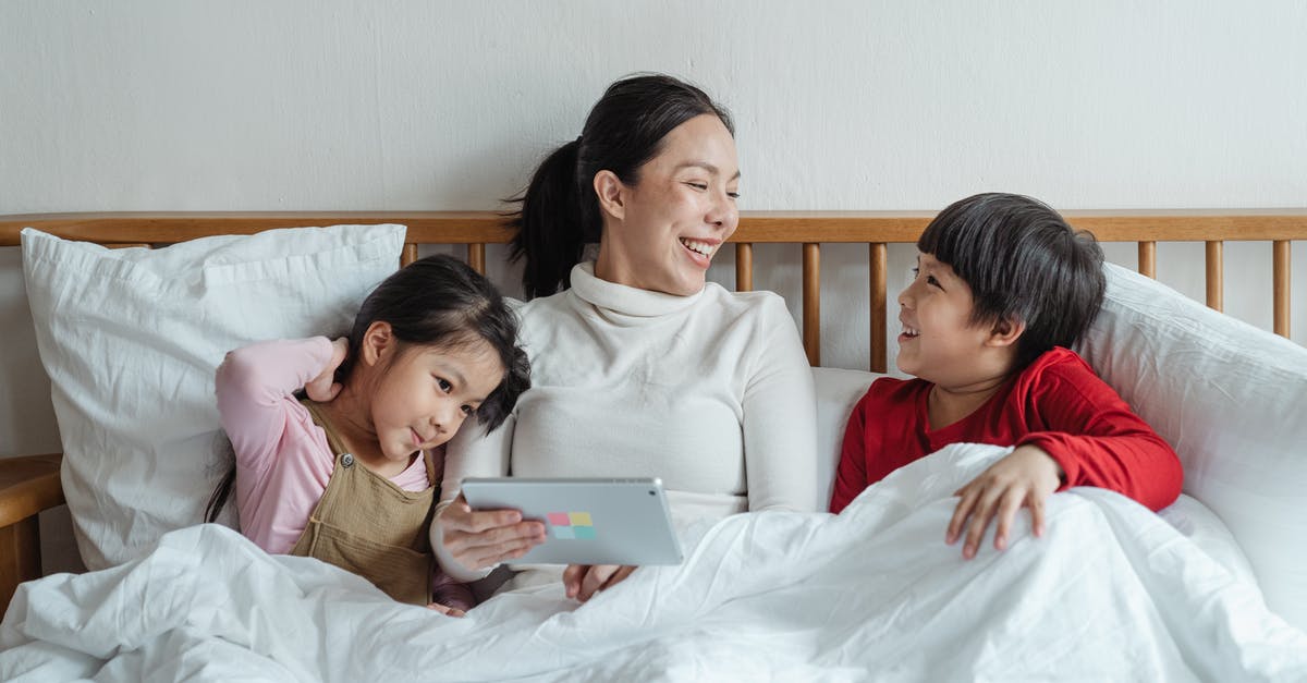 Must one always have one's passport when using NEXUS? - Positive ethnic mother and little daughter and son having fun together in cozy bed in morning while using tablet Must one always have one's passport when using NEXUS? - Positive ethnic mother and little daughter and son having fun together in cozy bed in morning while using tablet