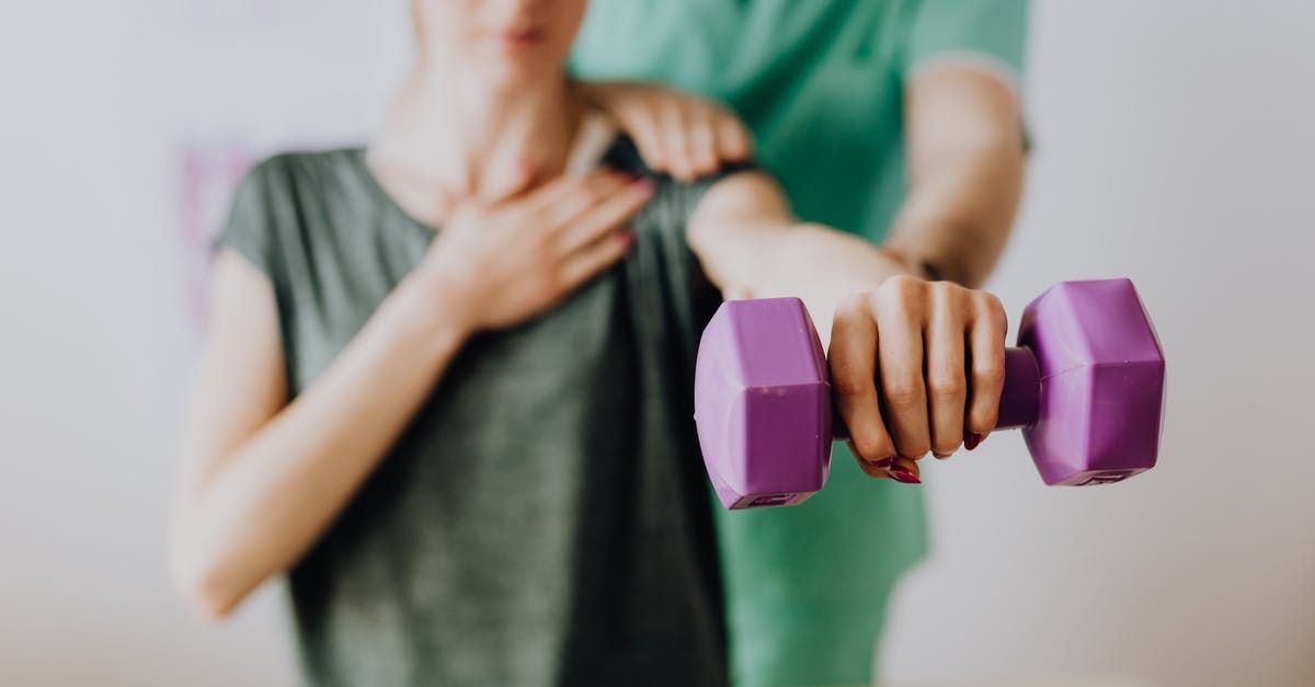 My business visit visa got refused and I need some help [duplicate] - Crop unrecognizable orthopedist in uniform helping slender female in casual wear reaching arm with dumbbell in doctor office in hospital