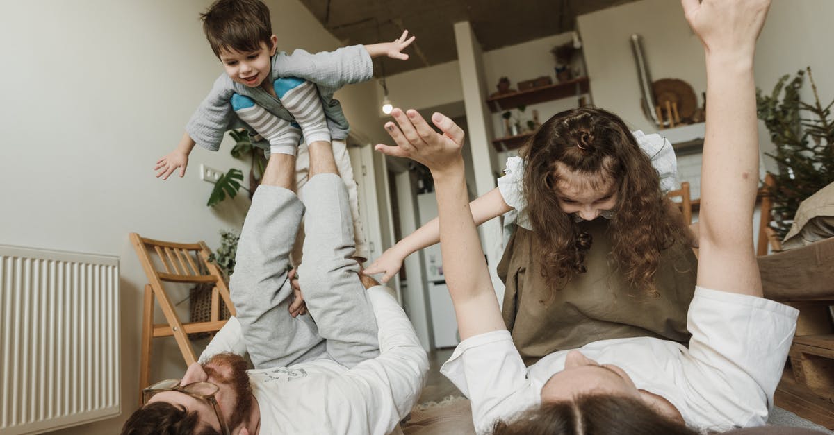 My family member has never flown, wondering if someone can meet him at his layover and lead him to his next plane - A Couple Playing Airplanes with their Children My family member has never flown, wondering if someone can meet him at his layover and lead him to his next plane - A Couple Playing Airplanes with their Children