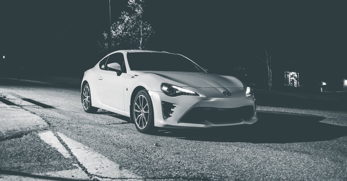 My fast track U.K. student visa is late without any letter of explanation? [closed] - Modern white car on street at night