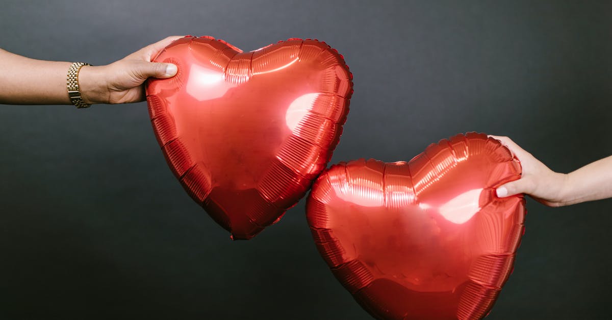 My fiancee's visa extension - Two Persons Holding Two Red Heart Shaped Balloons My fiancee's visa extension - Two Persons Holding Two Red Heart Shaped Balloons