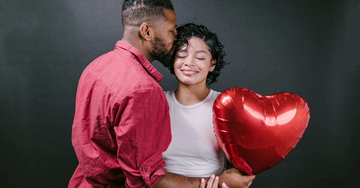 My fiancee's visa extension - Man Kissing His Woman While Holding a Red Heart Shaped Balloon My fiancee's visa extension - Man Kissing His Woman While Holding a Red Heart Shaped Balloon