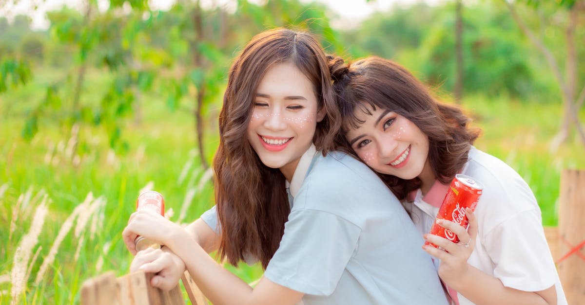 My friends flight was cancelled but mine wasn’t, what can I do? - Women Smiling Together while Holding a Canned Drink My friends flight was cancelled but mine wasn’t, what can I do? - Women Smiling Together while Holding a Canned Drink