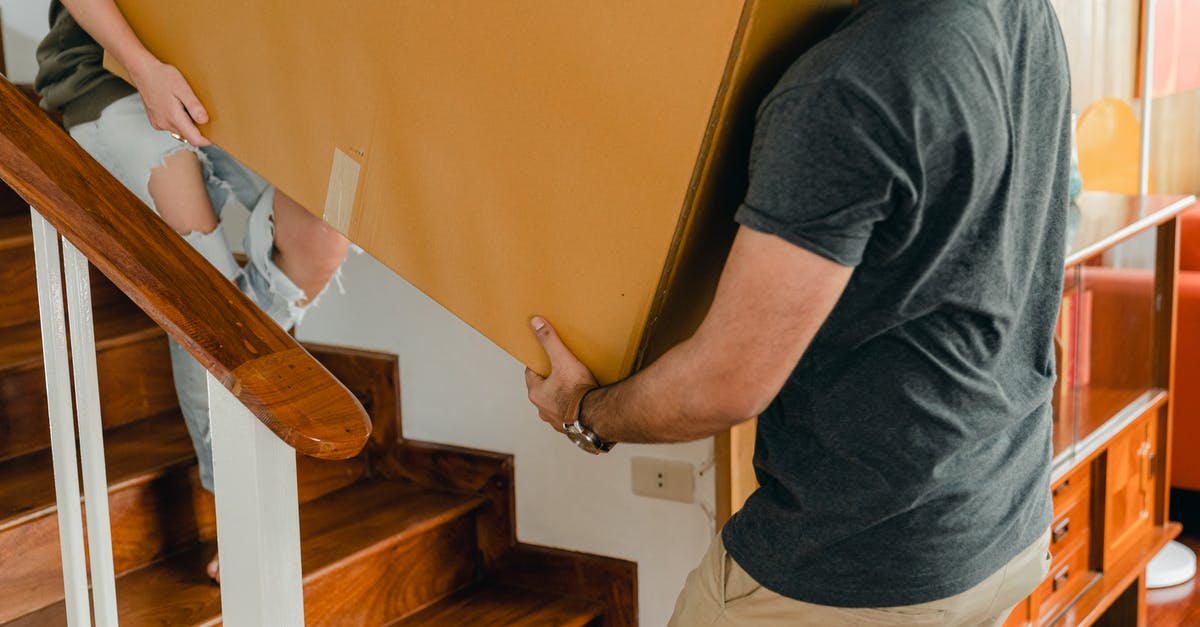 My Home address will change during ESTA period, is it affected? [duplicate] - Couple carrying personal items box down stairs