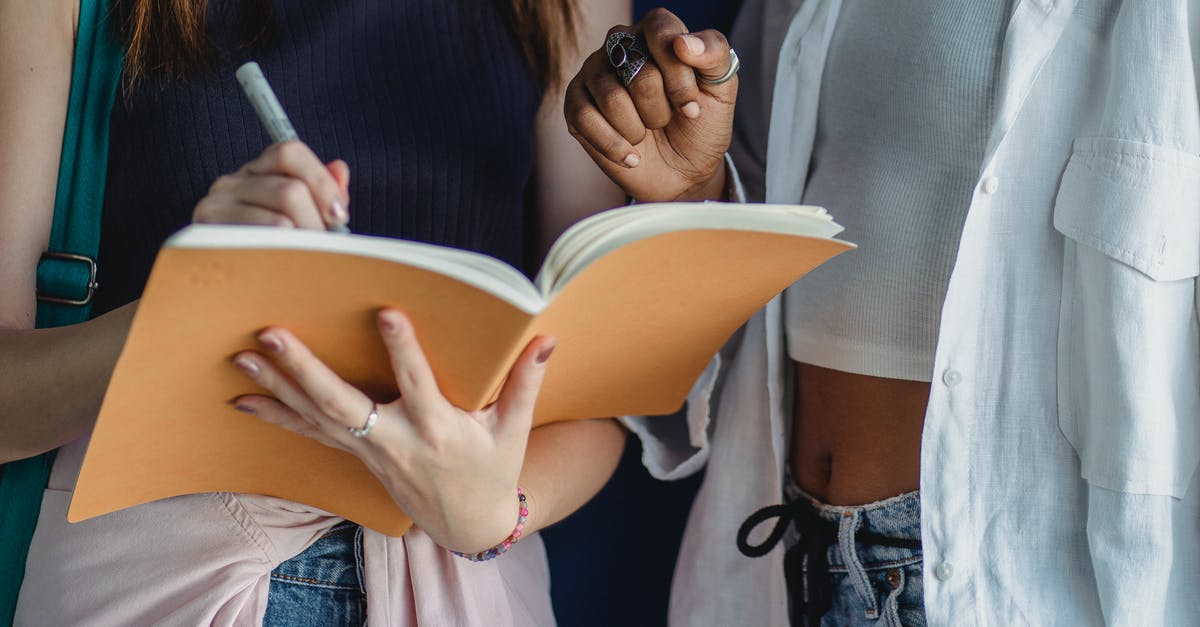 My Indian girlfriend studying in Tblisi, Georgia wants to visit me the UK during December. Please help with visa - Crop diverse girlfriends writing in exercise book