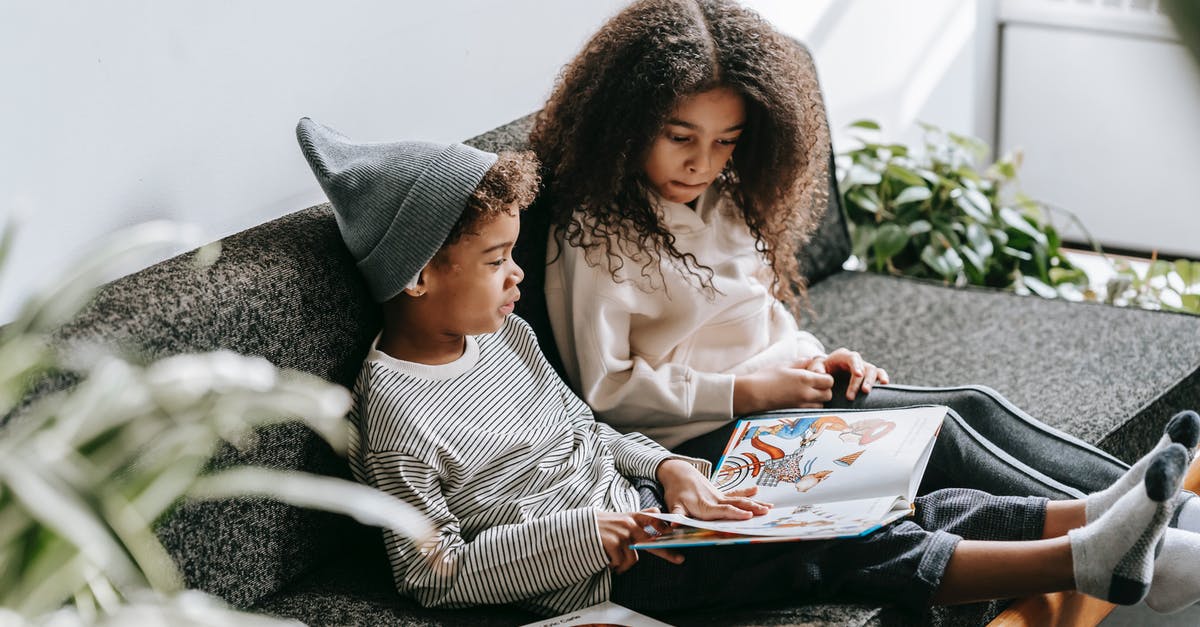 My Indian passport's first page is a little damaged. Is it going to be a problem? - Focused black children reading fairytale on sofa My Indian passport's first page is a little damaged. Is it going to be a problem? - Focused black children reading fairytale on sofa