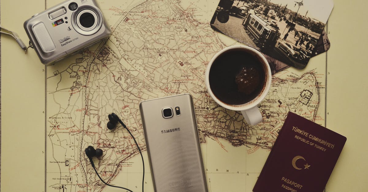 My passport is stuck at US embassy due to visa printing delay and I have travel plans - Silver Camera Near Black Coffee in Mug, Silver Samsung Galaxy S7, Turkey Passport, and Black Earbuds My passport is stuck at US embassy due to visa printing delay and I have travel plans - Silver Camera Near Black Coffee in Mug, Silver Samsung Galaxy S7, Turkey Passport, and Black Earbuds