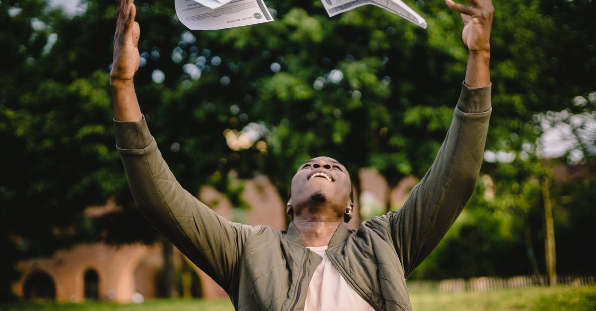 My sponsor currently does not have a job - Happy African American remote worker tossing papers in air happy to get rid of boring paperwork while sitting in green park My sponsor currently does not have a job - Happy African American remote worker tossing papers in air happy to get rid of boring paperwork while sitting in green park