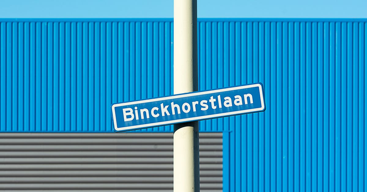 Name of this place - A White and Blue Sign Posted on a White Pole Name of this place - A White and Blue Sign Posted on a White Pole