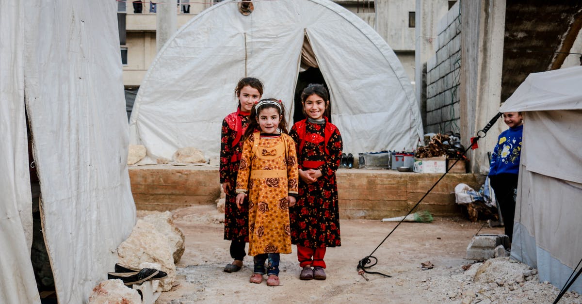 Need to add children to wife's itinerary - Three Girls in Floral Dresses Smiling and Standing Near White Tent Need to add children to wife's itinerary - Three Girls in Floral Dresses Smiling and Standing Near White Tent
