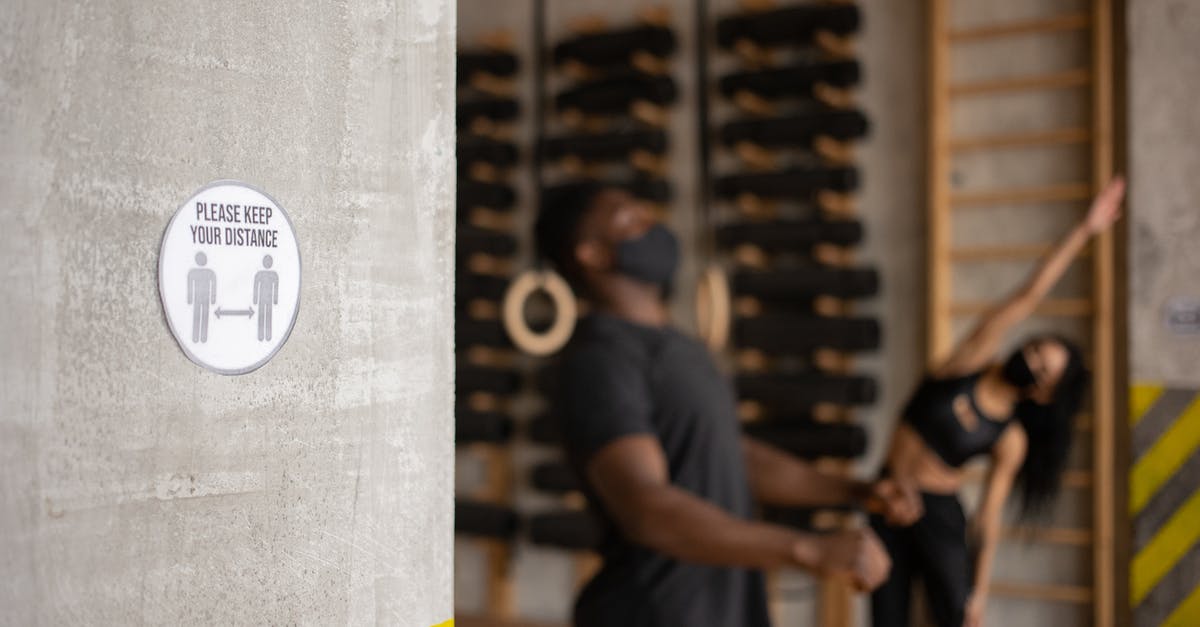 Need to keep ESTA active for Nexus card? - Distance sign in gym with unrecognizable black sportspeople during workout