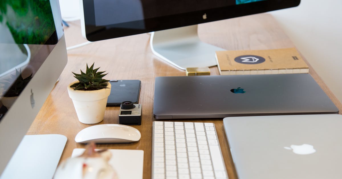 Need wireless internet access on Macbook Pro for travel in USA [duplicate] - Windows Flat Screen Computer Monitor Beside Two Silver Macbooks