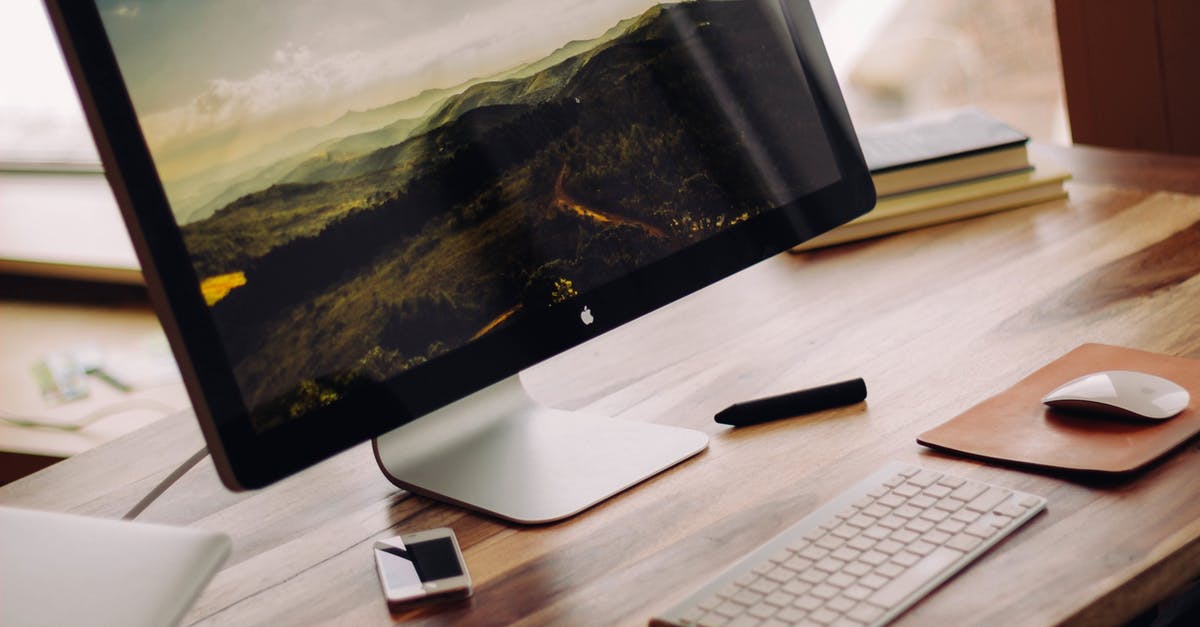 Need wireless internet access on Macbook Pro for travel in USA [duplicate] - Flat Screen Monitor Beside White Iphone