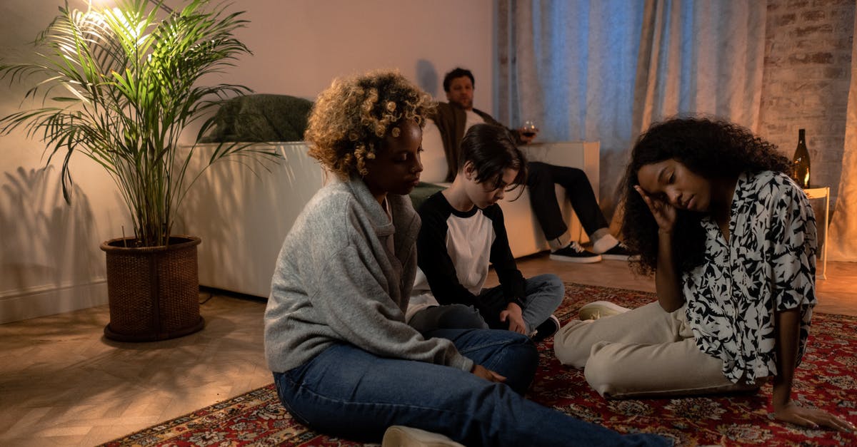 Negative COVID-test required during immigration at a Schengen layover or by the airline? - People Sitting on Floor Inside Room Negative COVID-test required during immigration at a Schengen layover or by the airline? - People Sitting on Floor Inside Room