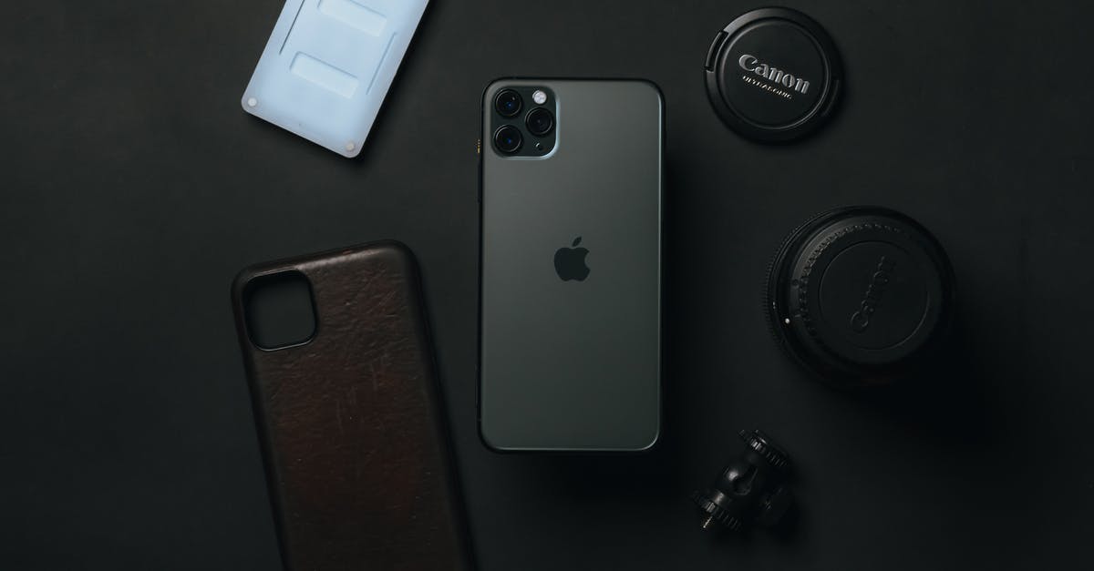 New application for UK visitor visa after previous refusal - From above of expensive smartphone placed near camera lens and phone case on dark table New application for UK visitor visa after previous refusal - From above of expensive smartphone placed near camera lens and phone case on dark table