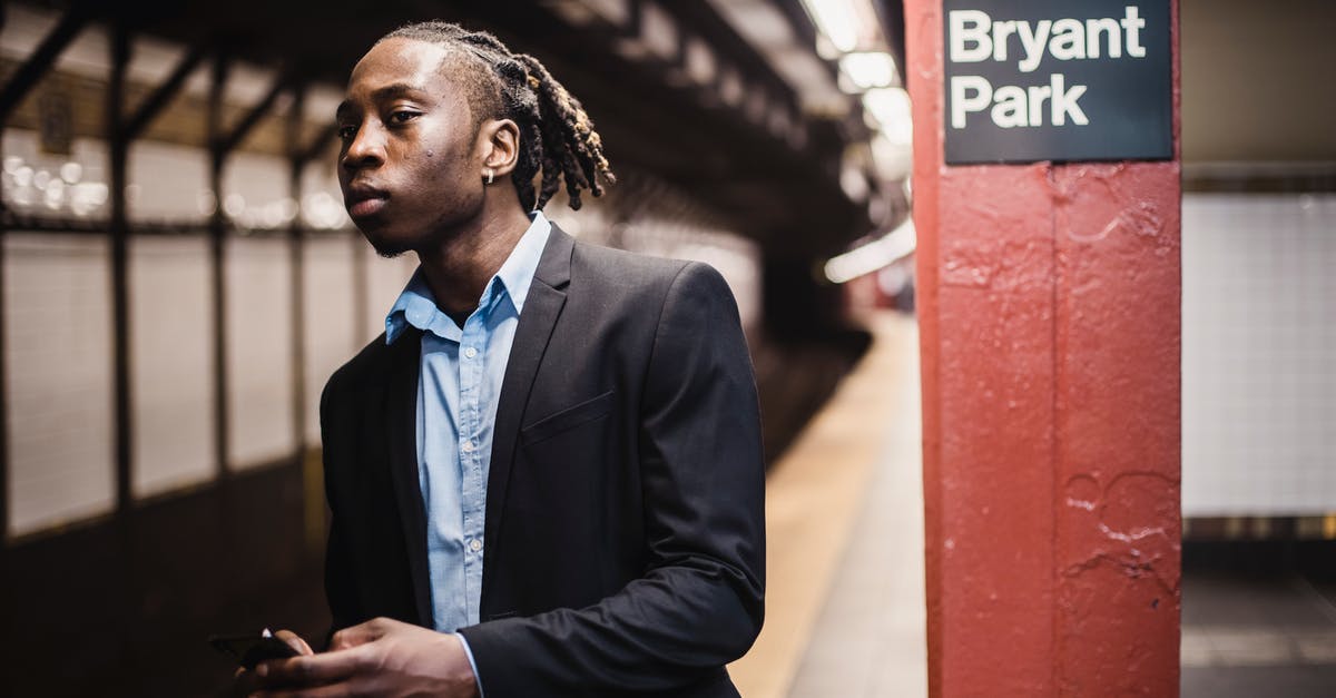 New dual citizen Canada/Australia - Serious young male waiting for train in New York underground New dual citizen Canada/Australia - Serious young male waiting for train in New York underground