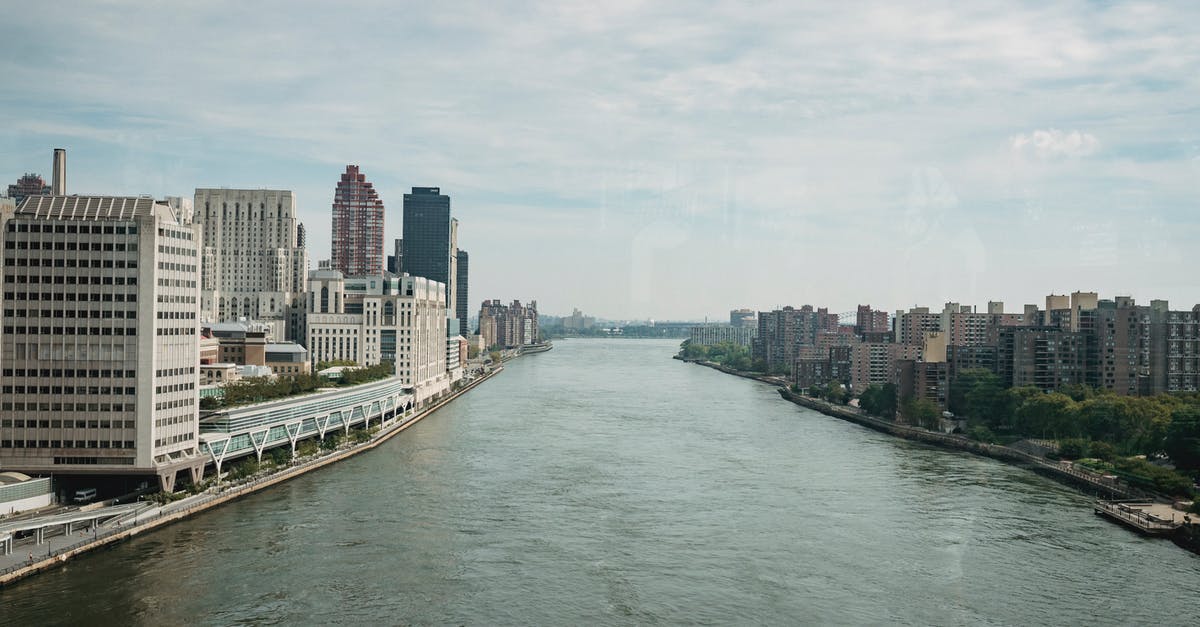 New York airports: JFK or EWR for brief stopover - Metropolis city district with spacious river