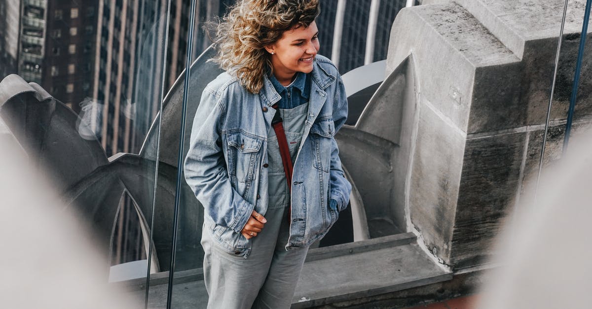 New York subway Q train - view of Brooklyn Bridge - Woman in Blue Denim Jacket Standing Near Gray Concrete Wall New York subway Q train - view of Brooklyn Bridge - Woman in Blue Denim Jacket Standing Near Gray Concrete Wall
