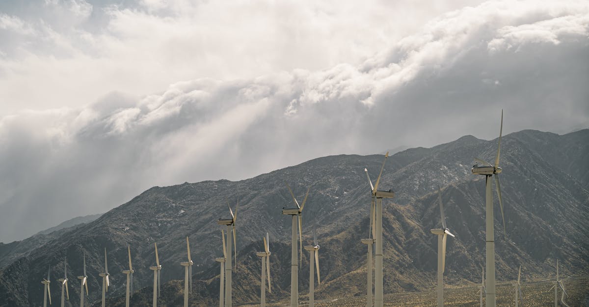 Next best alternative to travel? Virtual travel? - Wind Turbines Near Mountains Under A Cloudy Sky Next best alternative to travel? Virtual travel? - Wind Turbines Near Mountains Under A Cloudy Sky