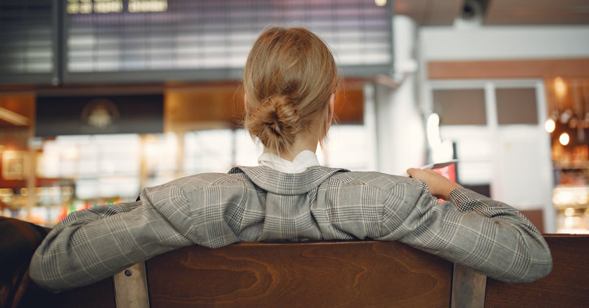 No more days left on my Schengen stay. Can I transit through EU airport back to the US? - Back view of female employee in trendy jacket waiting for train departure and leaning on backs of wooden seats in train station No more days left on my Schengen stay. Can I transit through EU airport back to the US? - Back view of female employee in trendy jacket waiting for train departure and leaning on backs of wooden seats in train station