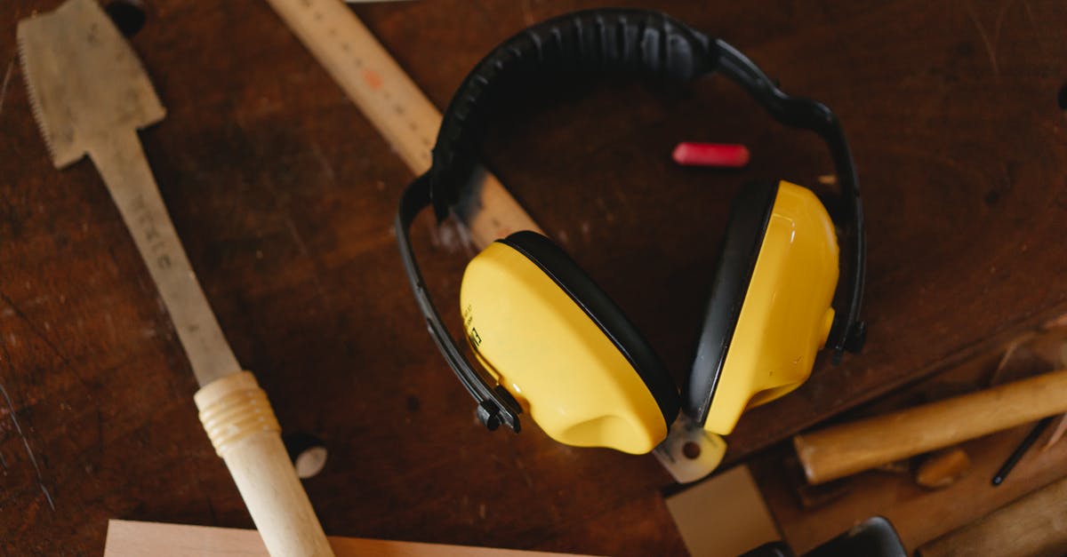 Noise cancelling headphones you can turn the noise cancellation on/off in [closed] - Protective headphones near carpentry tools on workbench