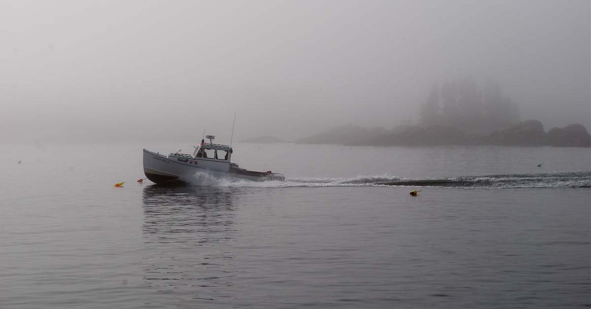 Non-AT country citizen visiting Antarctica by non-AT country registred vessel (yacht) — do I need a permit and why? - Modern motorboat floating on rippling river water on gloomy overcast weather in countryside Non-AT country citizen visiting Antarctica by non-AT country registred vessel (yacht) — do I need a permit and why? - Modern motorboat floating on rippling river water on gloomy overcast weather in countryside