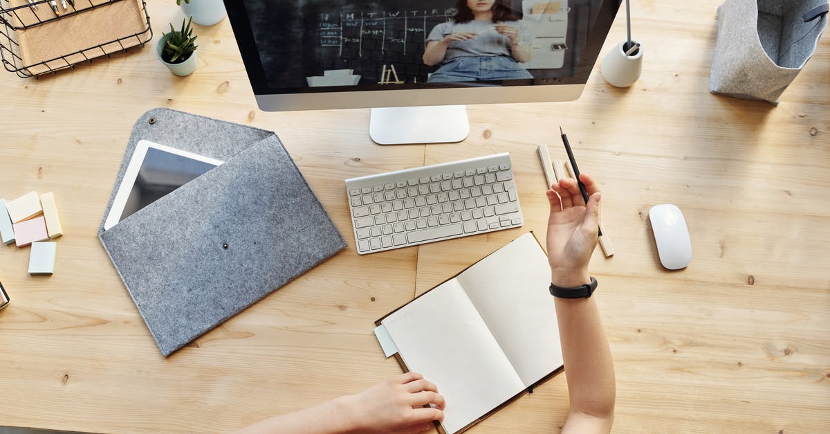 Non-EU citizen, student in Spain holding a residence permit. Do I need a UK visa? - Top View Photo of Girl Watching Through Imac