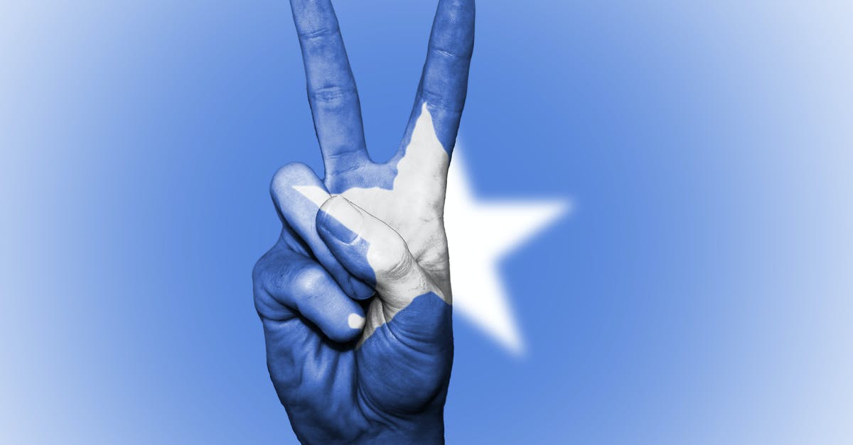 Non-EU National Visiting the UK with a Long-term Residence Permit Issued by a Schengen State - Blue and White Star Painted Hand in Peace-sign Gesture Non-EU National Visiting the UK with a Long-term Residence Permit Issued by a Schengen State - Blue and White Star Painted Hand in Peace-sign Gesture
