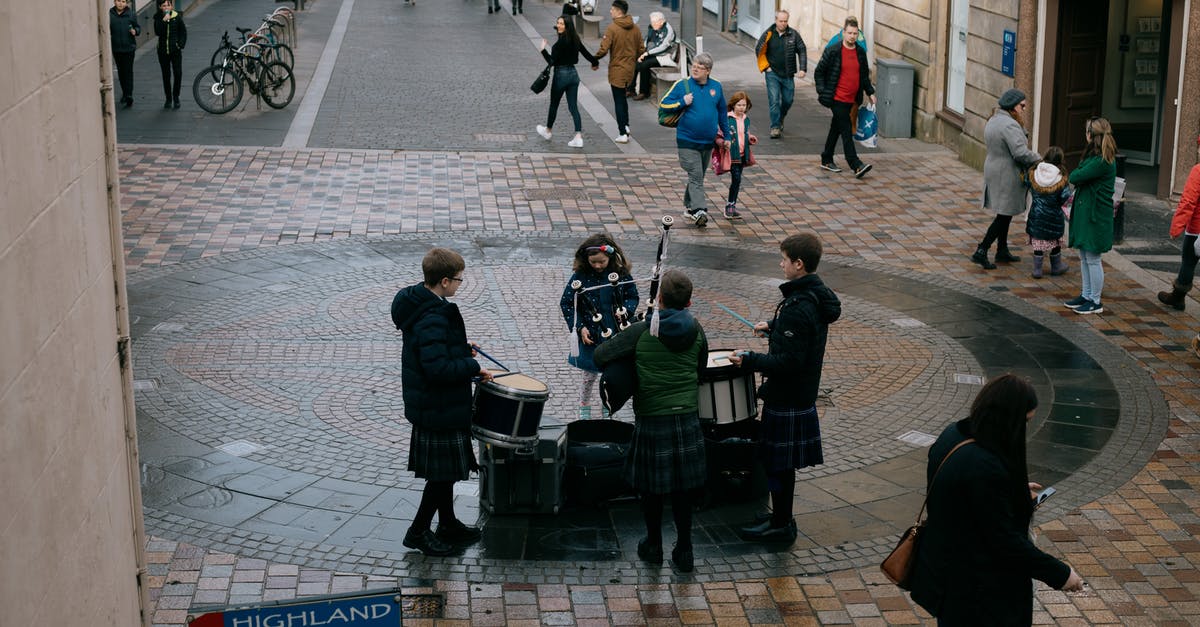 Non-EU visiting UK together with EU spouse and UK marriage certificate - Scottish teenage musicians wearing traditional clothes and playing drums and bagpipe on street on autumn day Non-EU visiting UK together with EU spouse and UK marriage certificate - Scottish teenage musicians wearing traditional clothes and playing drums and bagpipe on street on autumn day